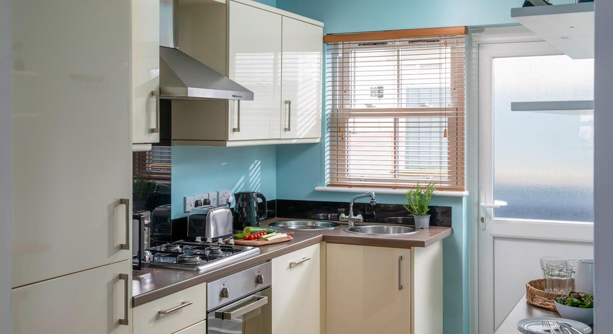 The kitchen is modern and well-equipped.