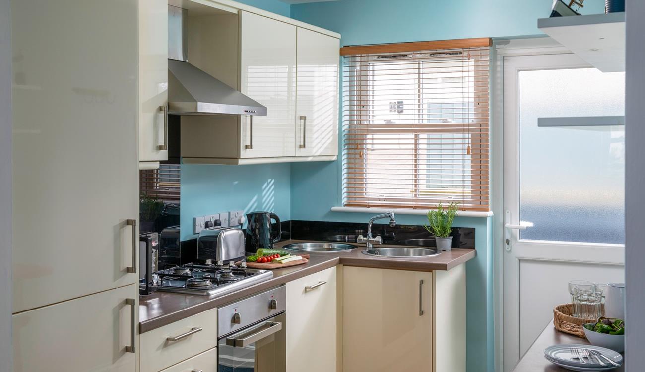 The kitchen is modern and well-equipped.