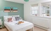 There's a serene coastal feel to the double bedroom. - Thumbnail Image