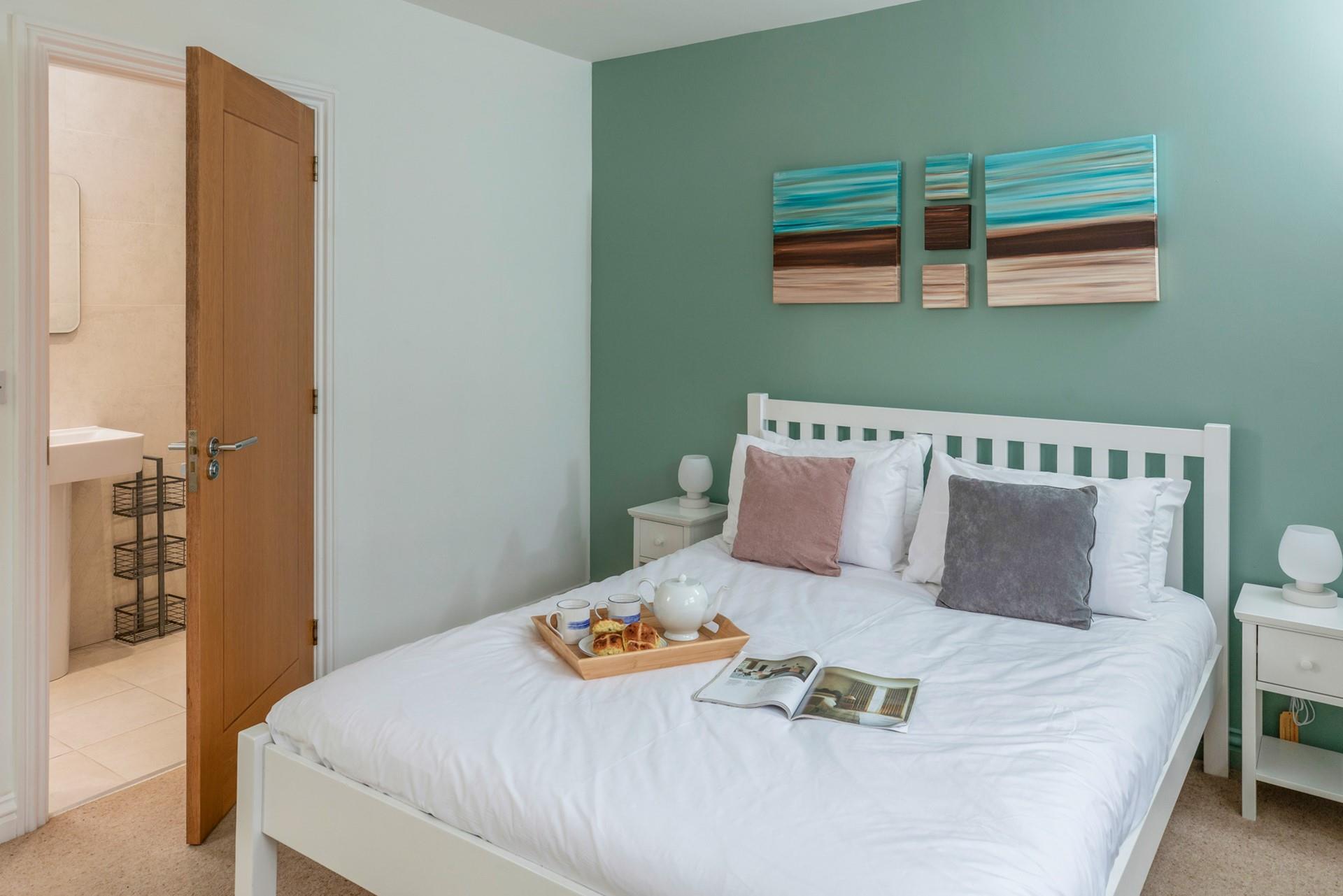 The double bedroom has a comfortable bed and en suite shower.