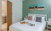 The double bedroom has a comfortable bed and en suite shower. - Thumbnail Image