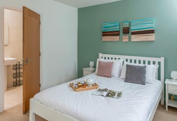 The double bedroom has a comfortable bed and en suite shower.