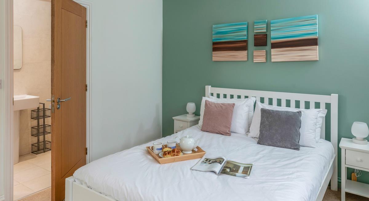 The double bedroom has a comfortable bed and en suite shower.