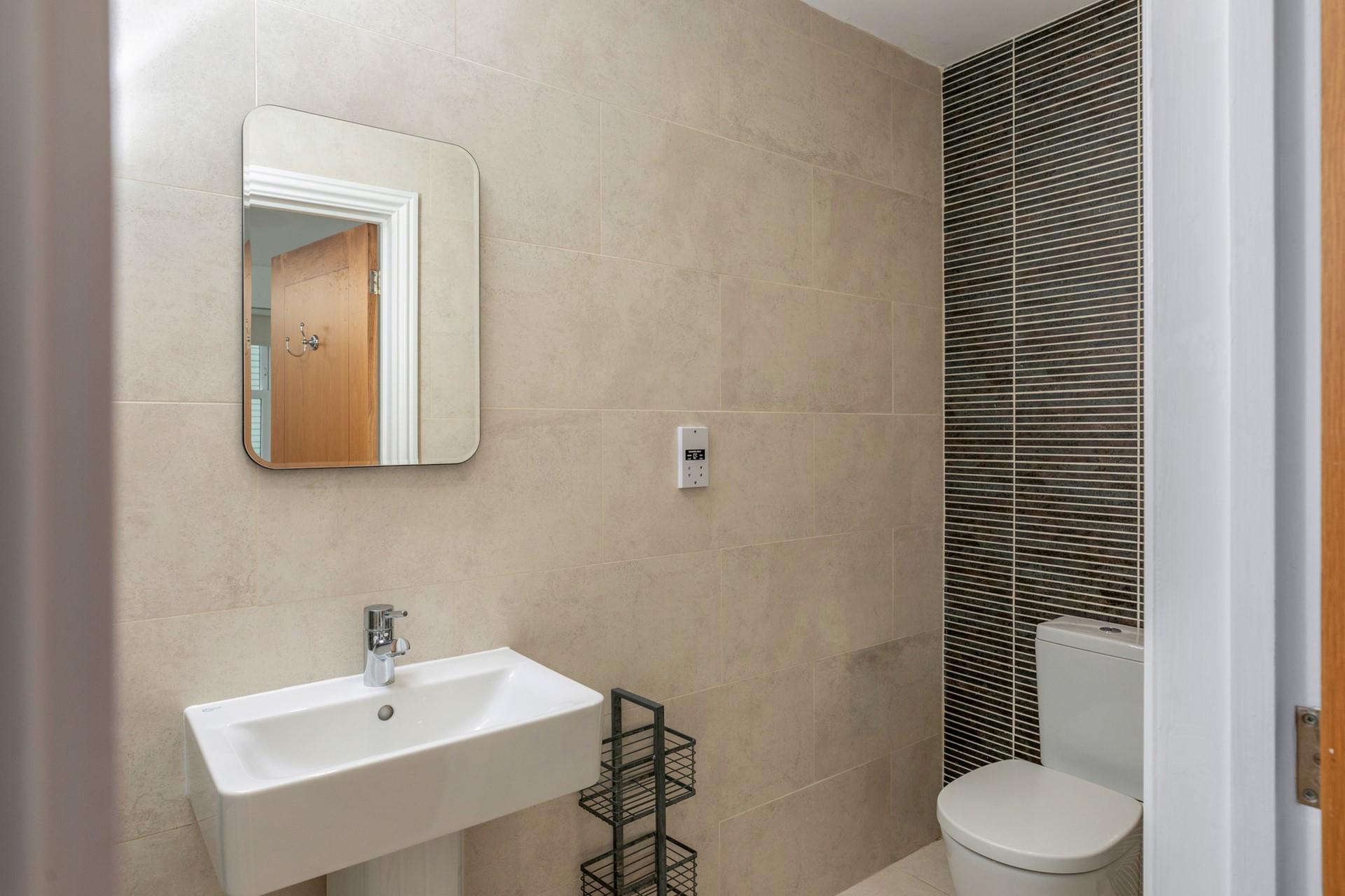 The stylish en suite shower in the double bedroom.