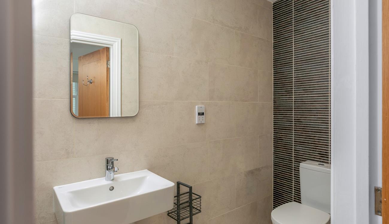 The stylish en suite shower in the double bedroom.