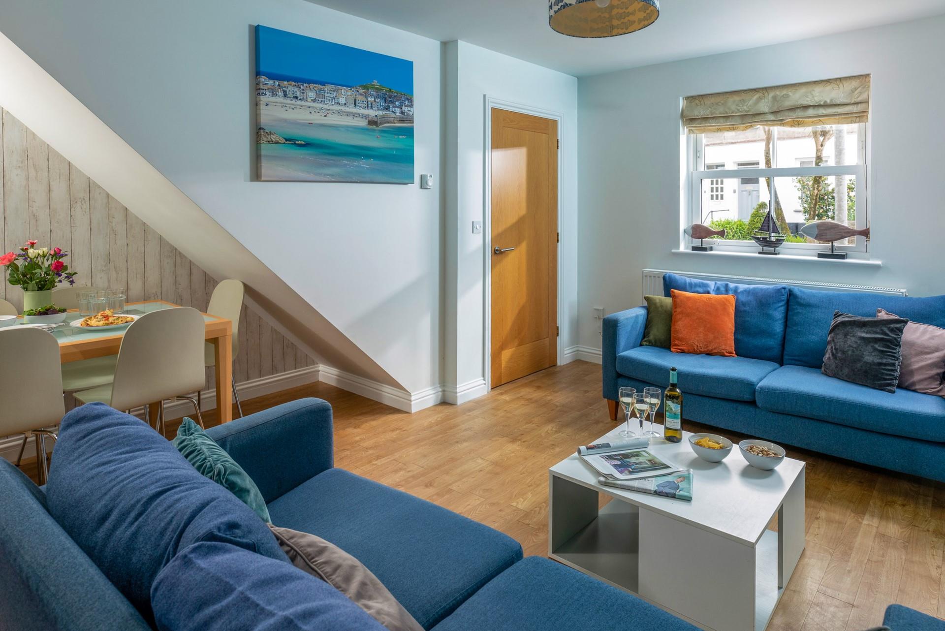 The sofas create a social space for the family to relax in the evening.