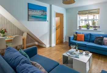 The sofas create a social space for the family to relax in the evening.