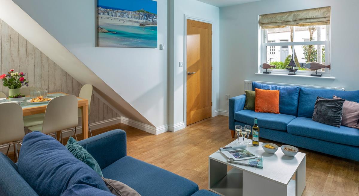 The sofas create a social space for the family to relax in the evening.