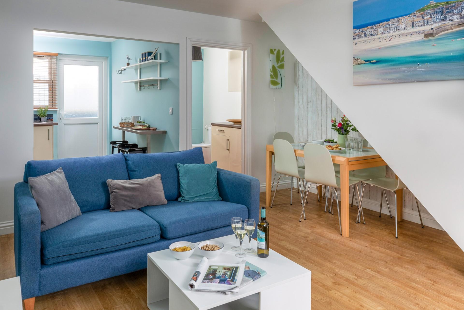 The light and airy living area is ideal for relaxing evenings together.