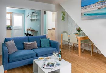 The light and airy living area is ideal for relaxing evenings together.