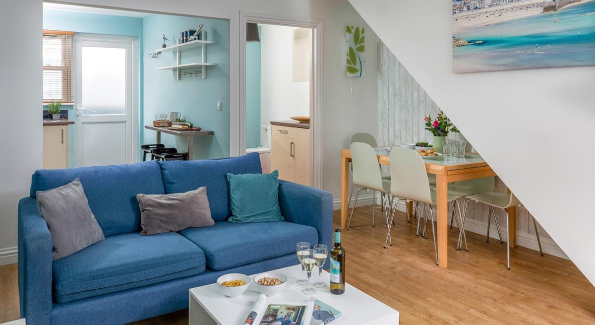 The light and airy living area is ideal for relaxing evenings together.