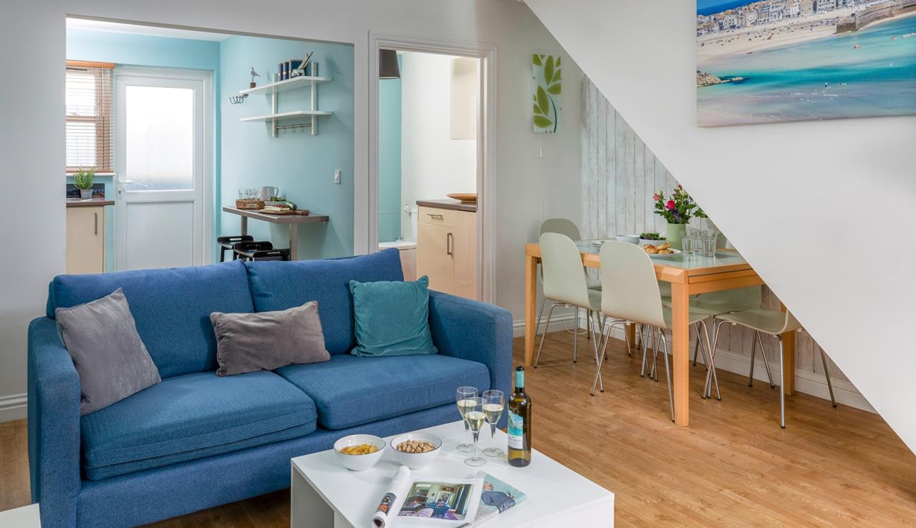 The light and airy living area is ideal for relaxing evenings together.