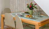 There's seating for six around the dining table. - Thumbnail Image
