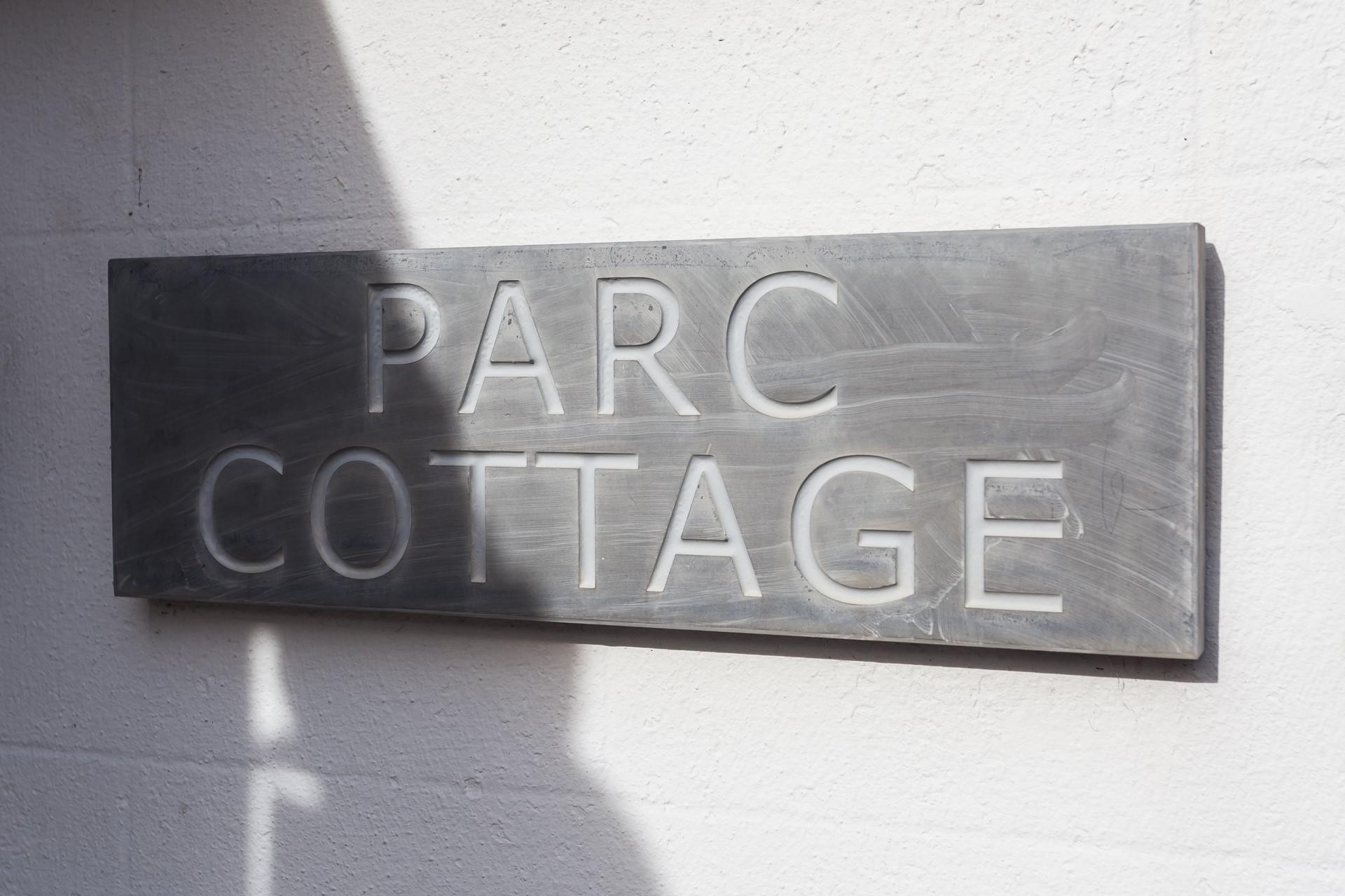 The traditional slate sign welcomes you to the property.