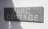 The traditional slate sign welcomes you to the property. - Thumbnail Image
