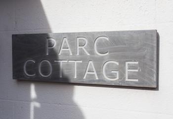 The traditional slate sign welcomes you to the property.