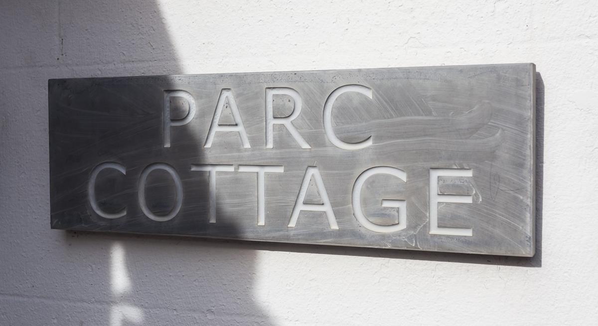 The traditional slate sign welcomes you to the property.