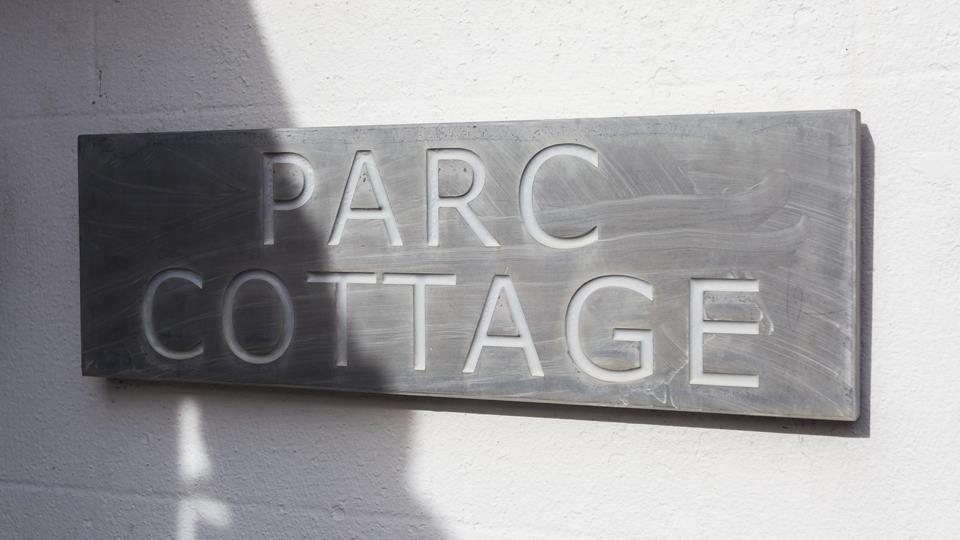 The traditional slate sign works perfectly against the whitewashed external wall facade.
