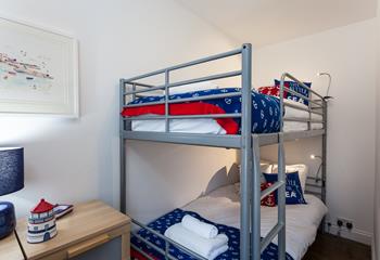 The nautical-themed bunk bedroom will be a hit with the little ones!