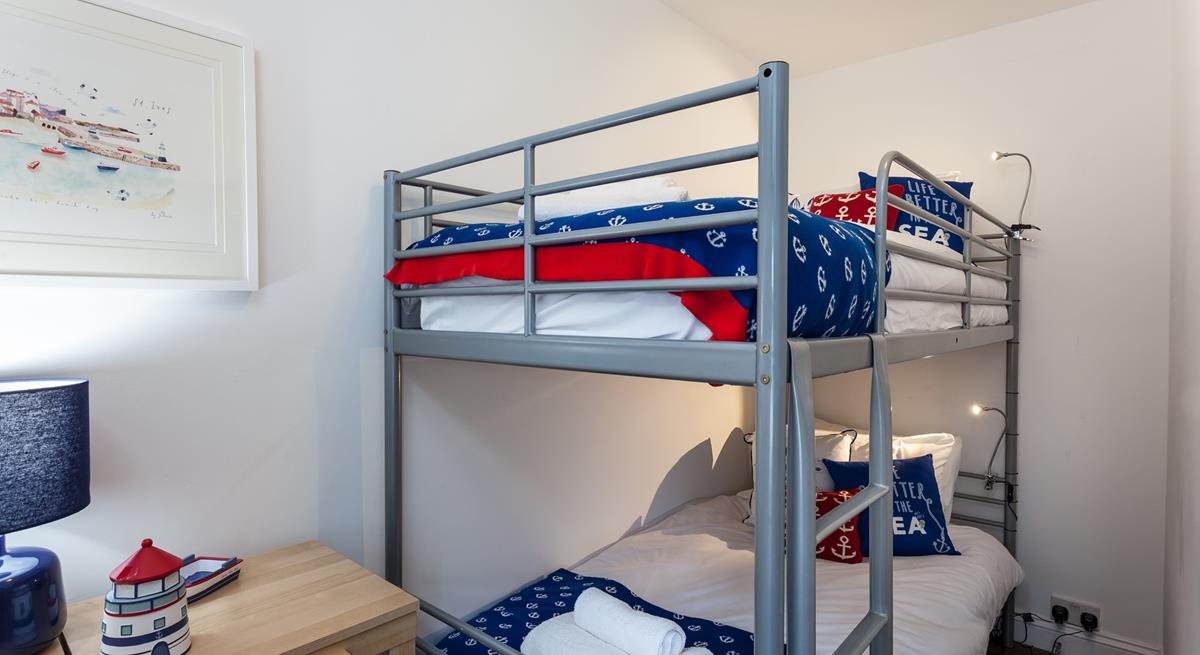 The nautical-themed bunk bedroom will be a hit with the little ones!