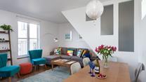 The sitting room is bright and cosy for relaxing evenings.