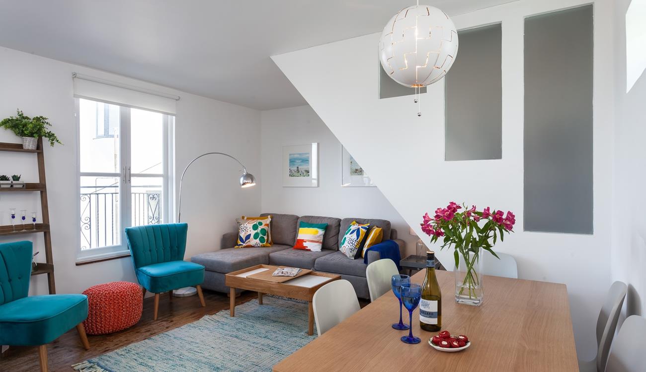 The sitting room is bright and cosy for relaxing evenings.