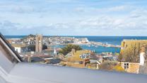 Enjoy views over the rooftops across to the quaint harbour.
