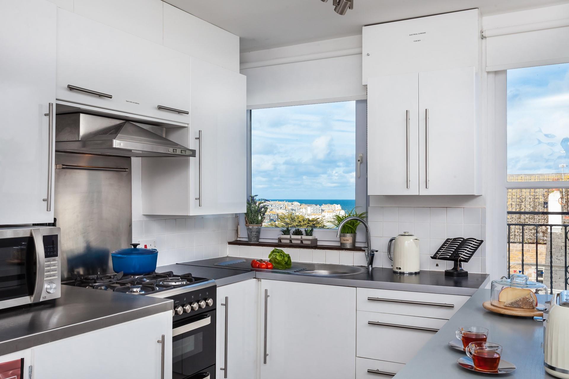 The well-equipped kitchen offers stunning views while you prepare meals!