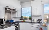 The well-equipped kitchen offers stunning views while you prepare meals! - Thumbnail Image