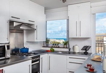 The well-equipped kitchen offers stunning views while you prepare meals!