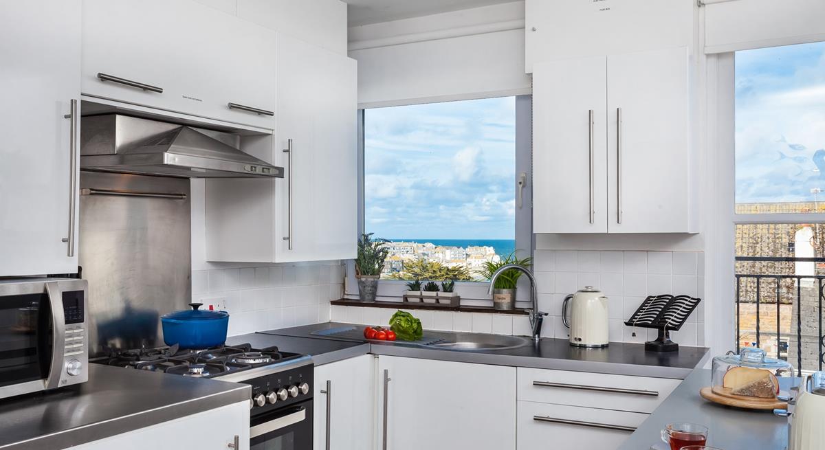 The well-equipped kitchen offers stunning views while you prepare meals!