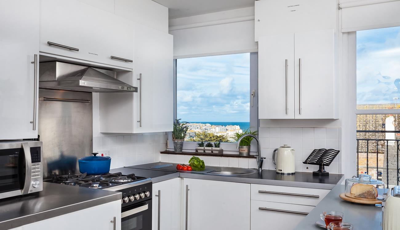 The well-equipped kitchen offers stunning views while you prepare meals!