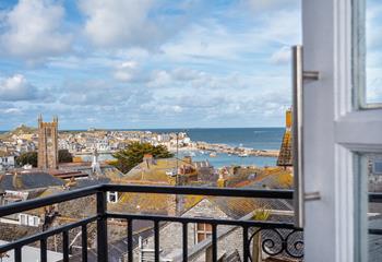 Sit out on the balcony with a glass of wine and watch the sunset over the Island.