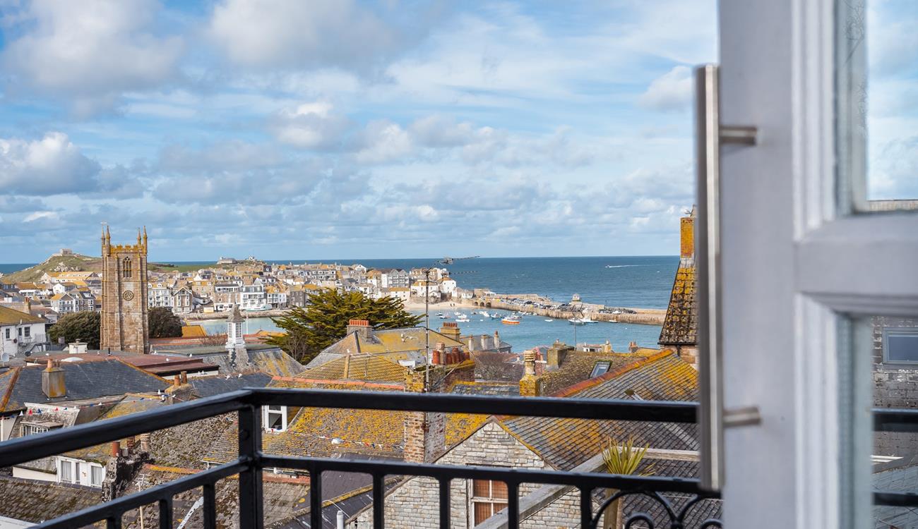 Sit out on the balcony with a glass of wine and watch the sunset over the Island.