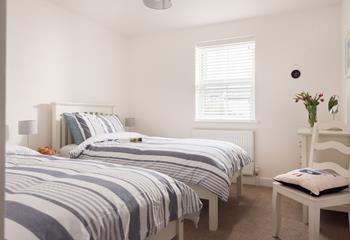 Bedroom 1 offers cosy twin beds, perfect for children or young adults.