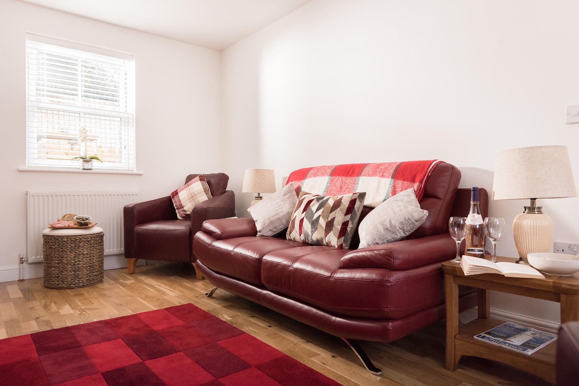 Luxurious leather sofas are the perfect place to settle down with a glass of something chilled and a good book!