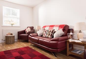 Luxurious leather sofas are the perfect place to settle down with a glass of something chilled and a good book!