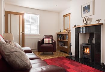 The cosy lounge with a welcoming woodburner is fabulous for relaxing after a busy day.