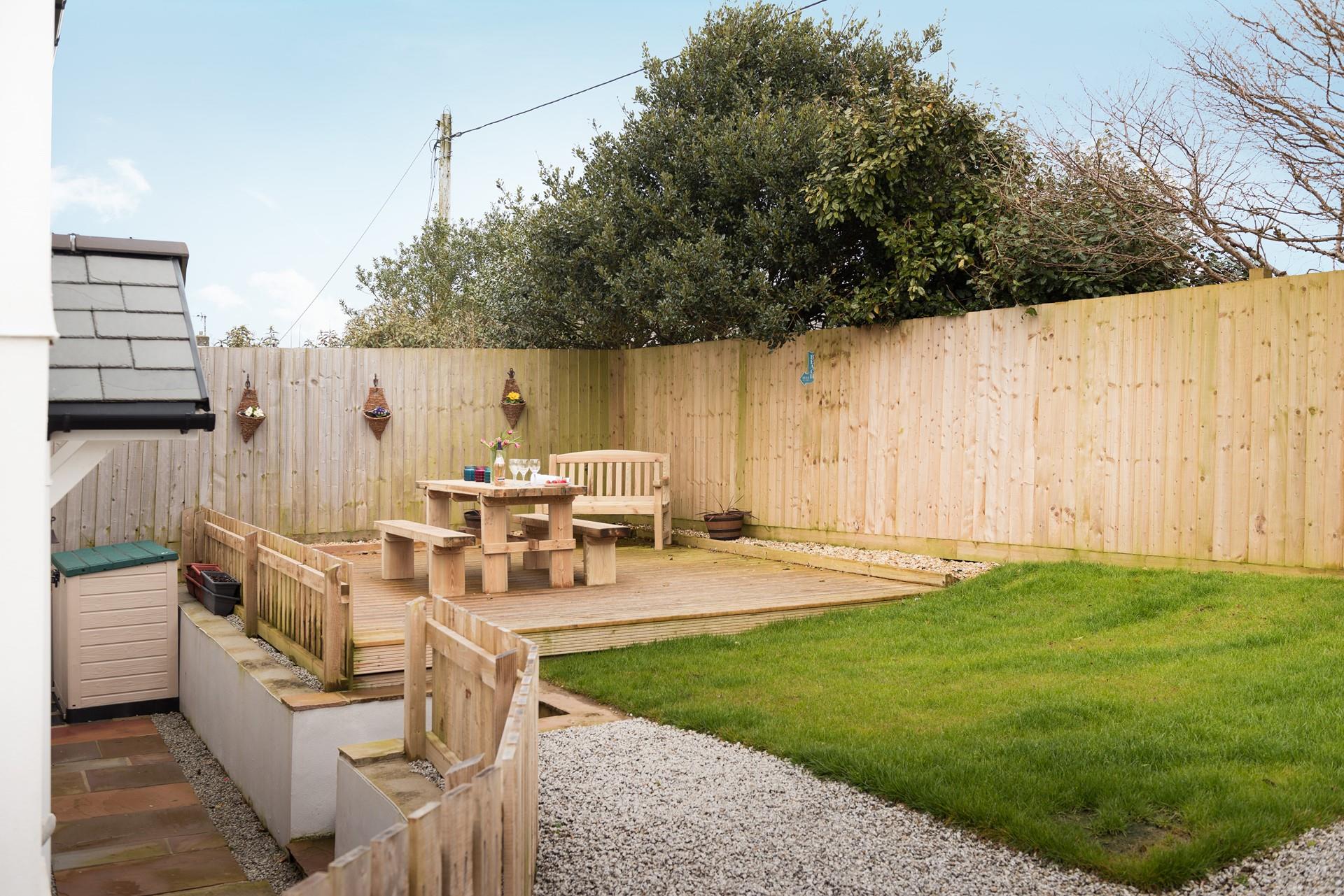 The garden is a lovely sun trap in the afternoons sun and has steps up from the back door. 