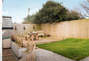 The garden is a lovely sun trap in the afternoons sun and has steps up from the back door. 