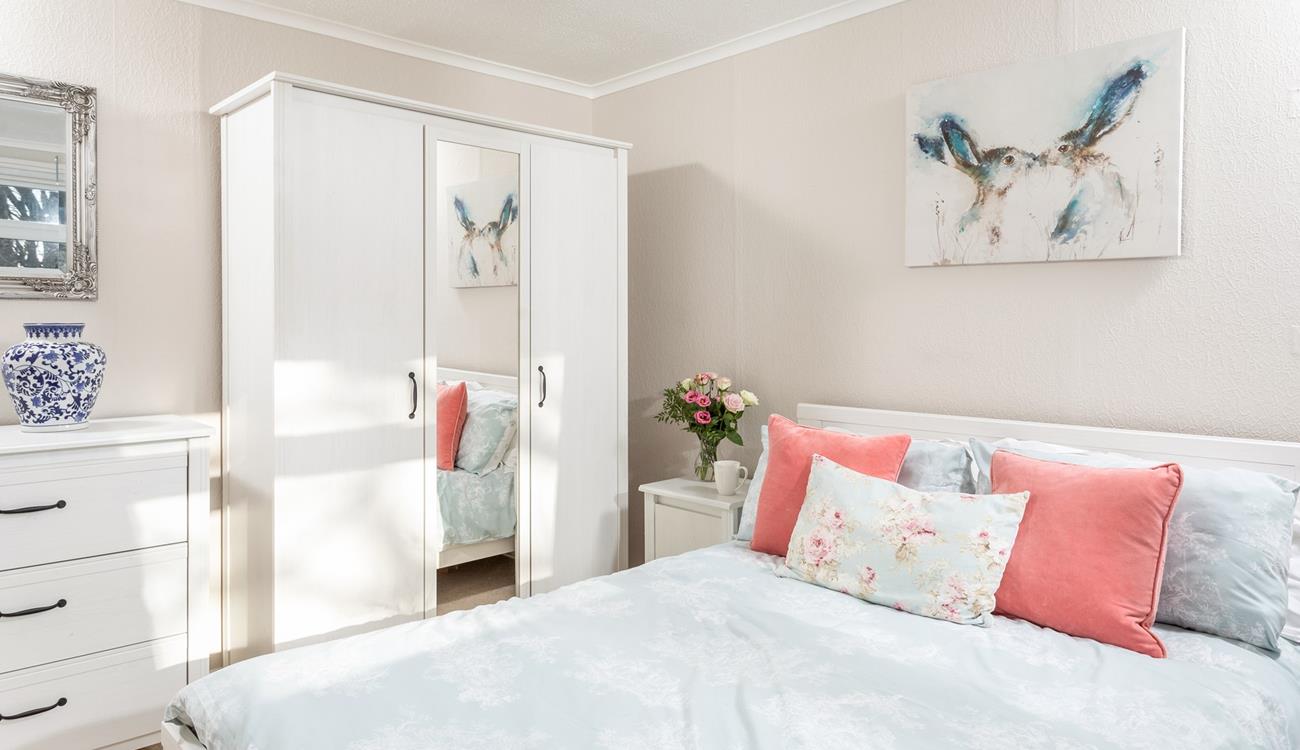 Imagine waking in this beautiful bedroom and opening the curtains to gaze out at gorgeous rural views.