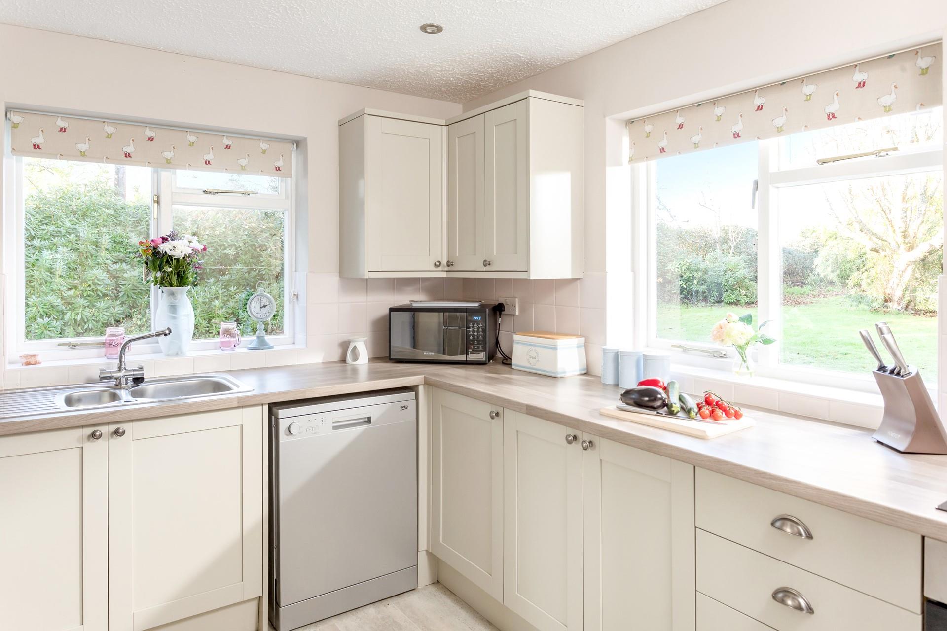 The kitchen also looks out to the garden, ideal for keeping an eye on the kids whilst you cook.