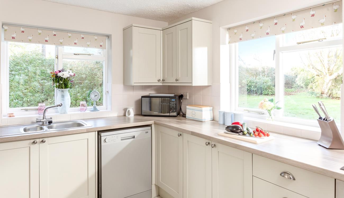 The kitchen also looks out to the garden, ideal for keeping an eye on the kids whilst you cook.
