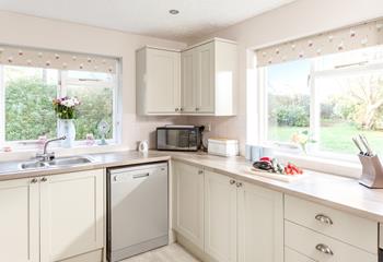 The kitchen also looks out to the garden, ideal for keeping an eye on the kids whilst you cook.