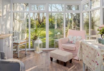 The conservatory dining room is accessed from the garden and is the perfect spot to relax. 
