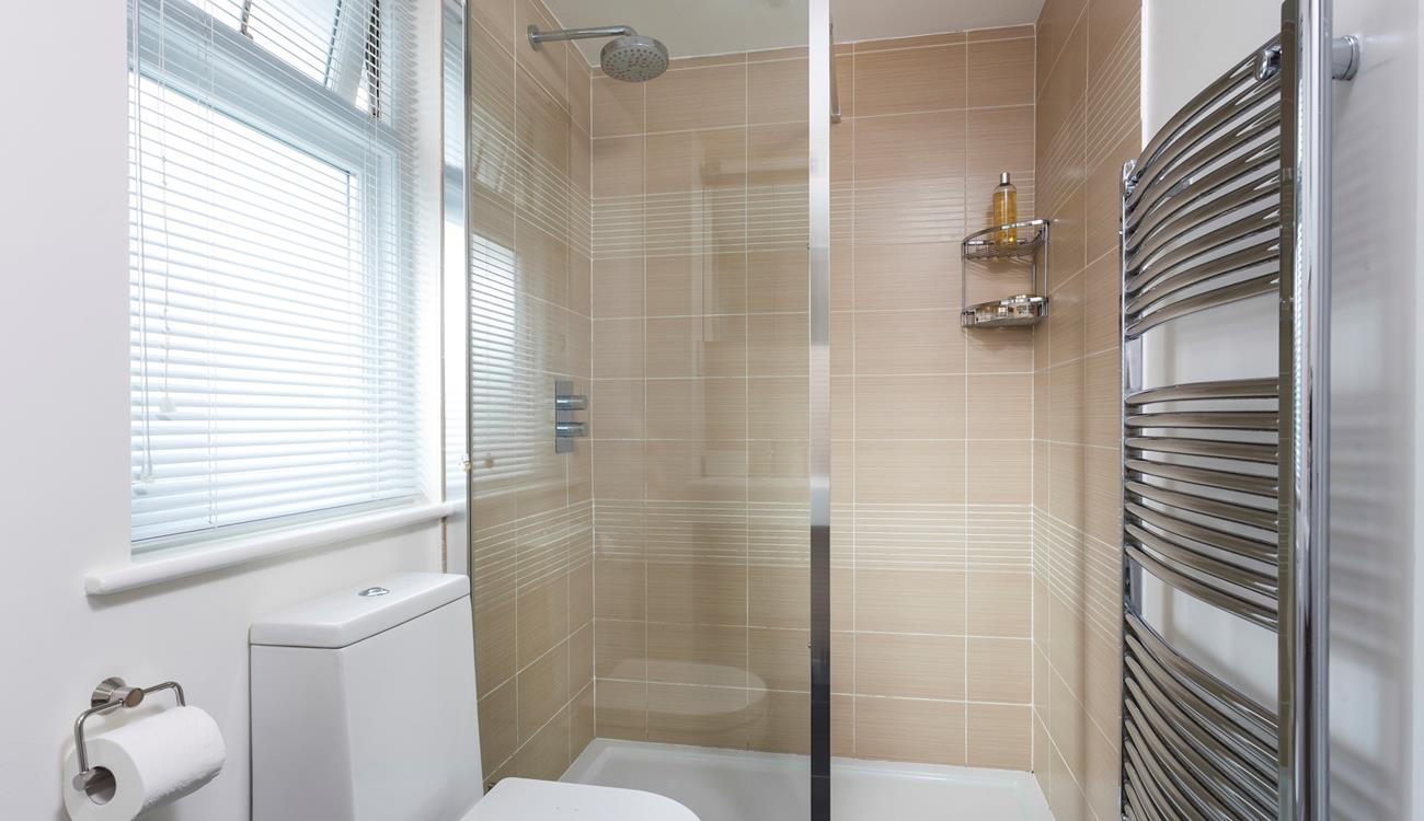 Freshen up for the day ahead in the rainfall shower.