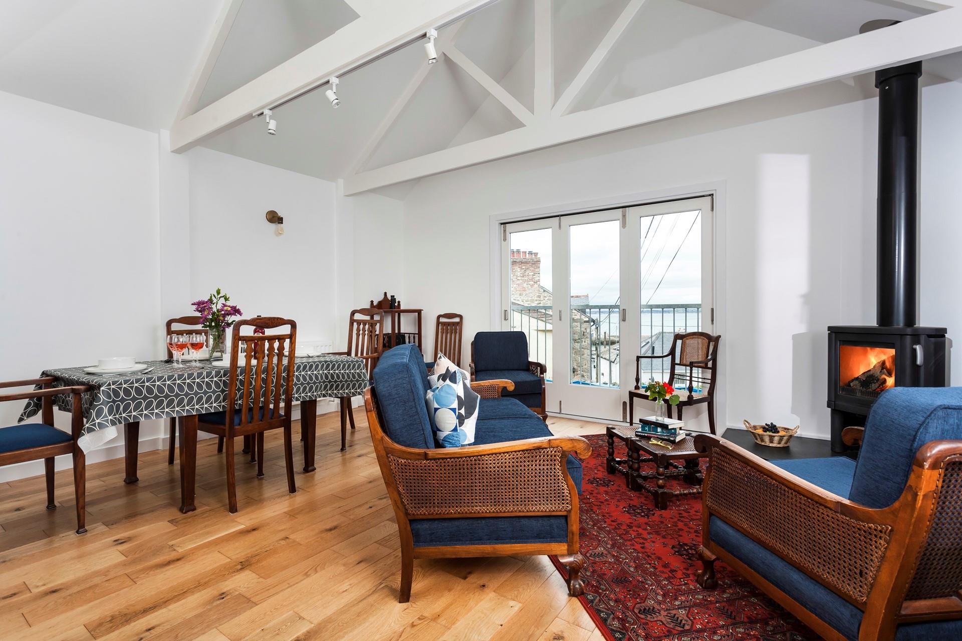 Enjoy a glass of wine in front of the woodburner with a sea view across Newlyn harbour and across to St Michael's Mount.
