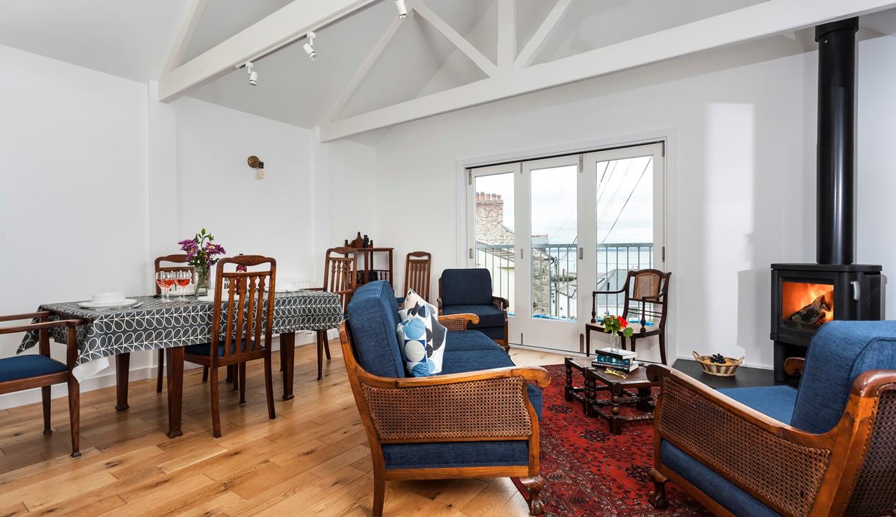 Enjoy a glass of wine in front of the woodburner with a sea view across Newlyn harbour and across to St Michael's Mount.