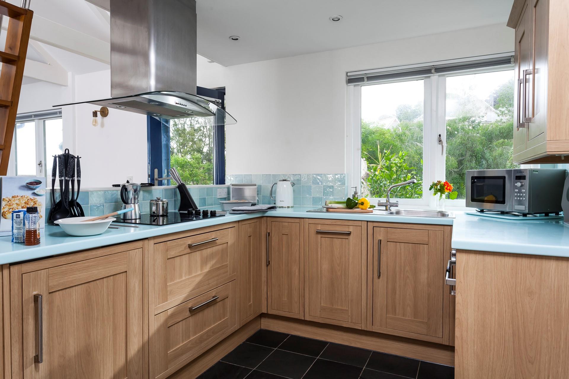 Cook up some culinary delights with a glorious garden view in the open living area. 