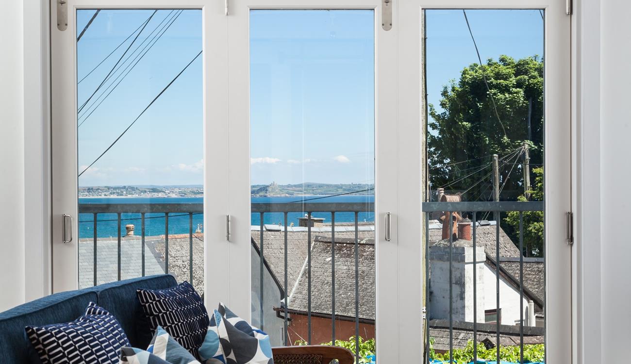 Sit in the window and gaze out towards St Michael's Mount with a cold drink in hand.